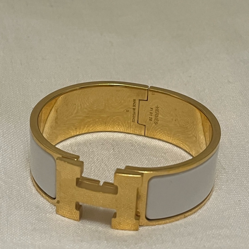 Hermès Gold and White “Clic Clac H” Bracelet